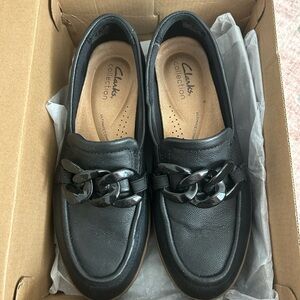 Clarks Black Leather Loafers with Chunky Chain Accent